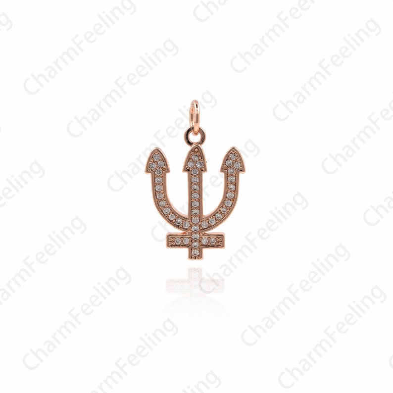 May include: A rose gold trident charm with clear cubic zirconia stones. The charm is a popular symbol of strength and power.