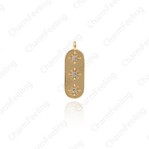 May include: Gold pendant charm with a rectangular shape and three small star-shaped accents with clear rhinestones.