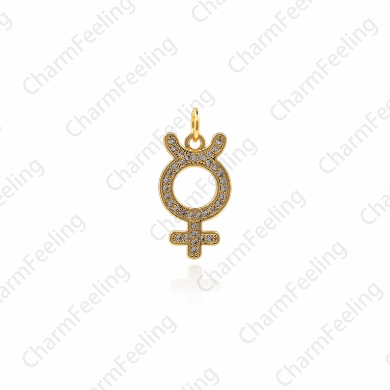 May include: Gold charm pendant with a clear crystal encrusted symbol of the planet Venus. The charm is a symbol of love, beauty, and femininity.