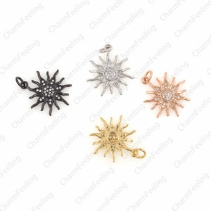 Puede incluir: Cuatro colgantes de sol con un centro de cristal y un bucle para sujetar a un collar o pulsera. Los colgantes est&aacute;n disponibles en negro, plata, oro y oro rosa.