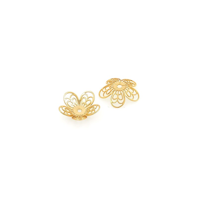 May include: Two gold-colored metal flower-shaped bead caps with intricate designs.