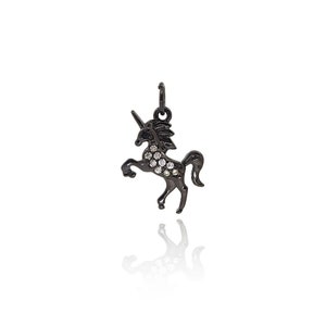 May include: Black unicorn charm with clear crystal accents. The charm is made of metal and has a loop for attaching to a necklace or bracelet.