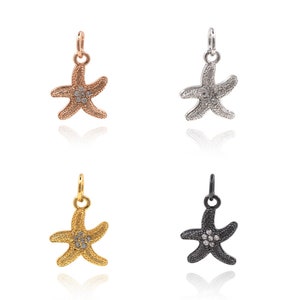 May include: Four starfish charms with a diamond-like design in four different metal finishes: rose gold, silver, gold, and black.