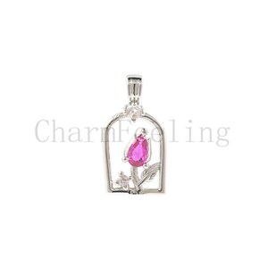 May include: Silver pendant featuring a pink rose with a pear-shaped gemstone in the centre, surrounded by smaller clear gemstones. The rose is enclosed in a silver frame.