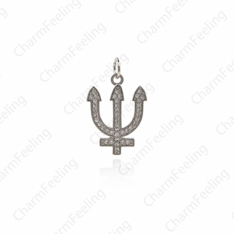 May include: Silver charm pendant in the shape of a trident with clear cubic zirconia stones.
