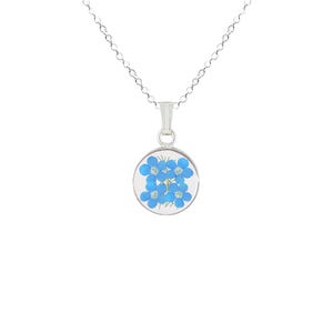 May include: A silver necklace with a round pendant featuring a pressed forget-me-not flower design.