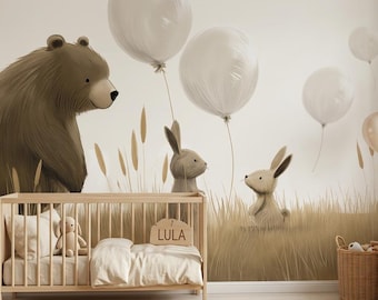 May include: A nursery wall mural featuring a large brown bear and two small rabbits in a field of tall grass. Several white balloons float above the animals. A wooden crib with the name LULA on a plaque sits in front of the mural.