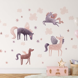 May include: Wall decals featuring whimsical unicorns with wings, in shades of purple, pink, and brown. The design includes stars and cloud shapes, creating a magical, fairytale theme. A pink trunk, star-shaped light, and balloons complete the decor.