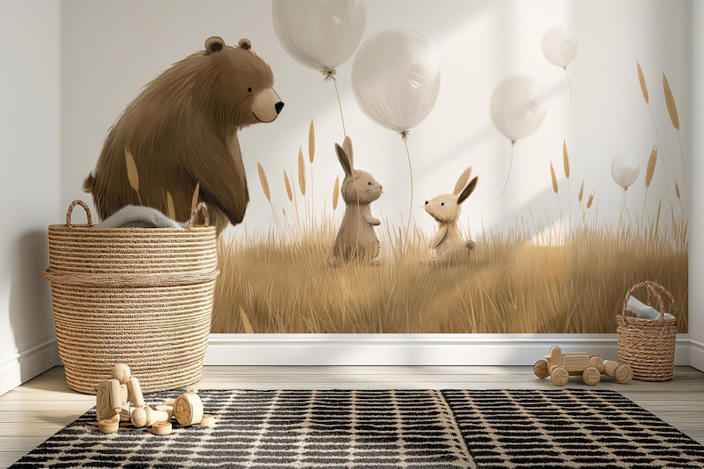 Może przedstawiać: Fantazyjna ilustracja przedstawiająca brązowego niedźwiedzia, dwa króliki i białe balony na tle wysokich, złotych traw.