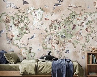 May include: A wall mural featuring a world map with watercolor illustrations of various animals, birds, and sea creatures across the continents, set against a beige background. A bed with olive green bedding and a dark blue throw blanket sits in front.