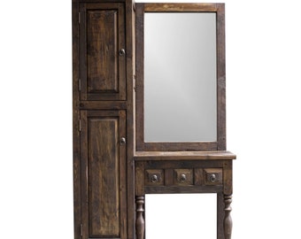 May include: A dark brown wooden vanity with a mirror and two doors. The vanity has three drawers and turned legs.