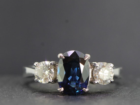 Elegant Sapphire and Diamond Trilogy Platinum Ring