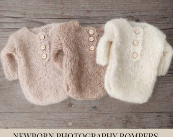 May include: Three soft alpaca newborn photography rompers in light pink, tan, and cream colors. Each romper has a henley neckline with three wooden buttons. The text at the bottom reads "NEWBORN PHOTOGRAPHY ROMPERS - SOFT ALPACA."