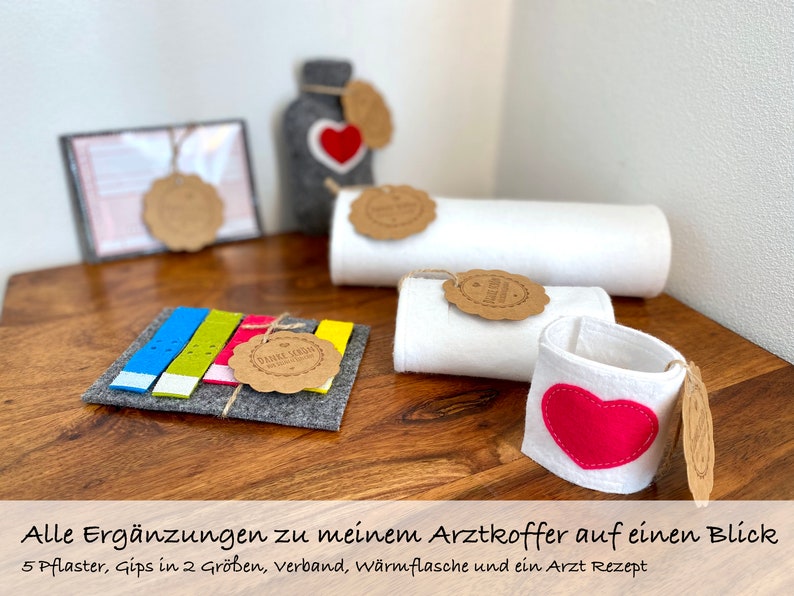 Alle Ergänzungen zu meinem Arztkoffer auf einen Blick. 5 Pflaster, Gips in 2 Größen, Verband, Wärmflasche und ein Arzt Rezept.