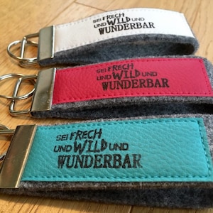 Felt keychain with imitation leather, lanyard, printed, stamp, text &quot;Be cheeky and wild and wonderful&quot;