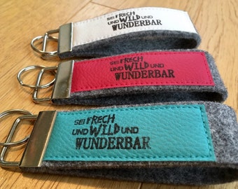 Felt keychain with imitation leather, lanyard, printed, stamp, text "Be cheeky and wild and wonderful"