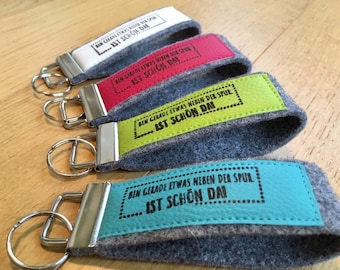 Felt key chain with imitation leather, lanyard, printed, stamp, text "I'm just a bit off track. It's nice there!"