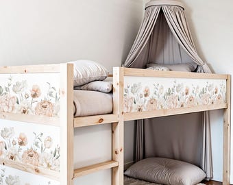 May include: A wooden loft bed with a floral patterned wallpaper and a white canopy. The bed has a shelf underneath and a pillow on the bed.