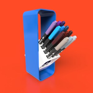 May include: A blue plastic pen holder with a white interior holds a variety of coloured markers. The markers are arranged in a fan shape, with the tips of the markers facing outwards.
