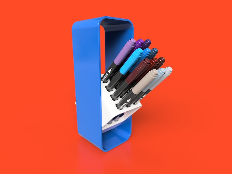 May include: A blue plastic pen holder with a white interior holds a variety of coloured markers. The markers are arranged in a fan shape, with the tips of the markers facing outwards.