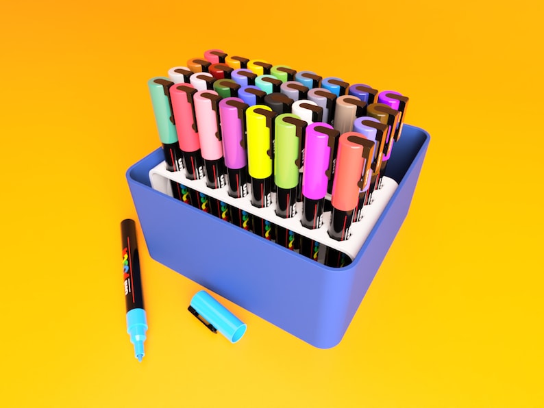 POSCA Paint marker holder case in white and blue. Case is shown in open position at 90 degree angle holding 32 POSCA PC-3M Paint markers.