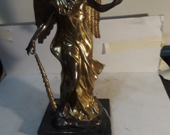 Angle bronze statue on marble base