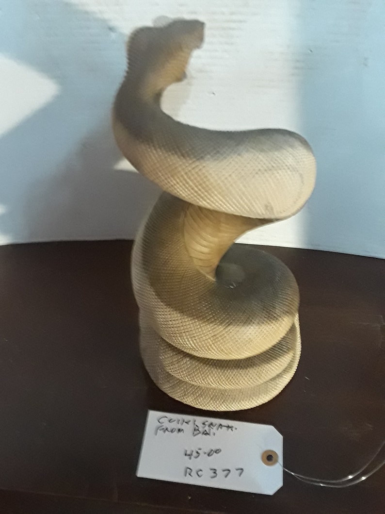 Snake coiled from Bali hard wood some teeth missing