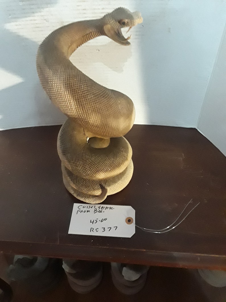 Snake coiled from Bali hard wood some teeth missing