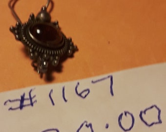 Silver. 925  red stone pendant?