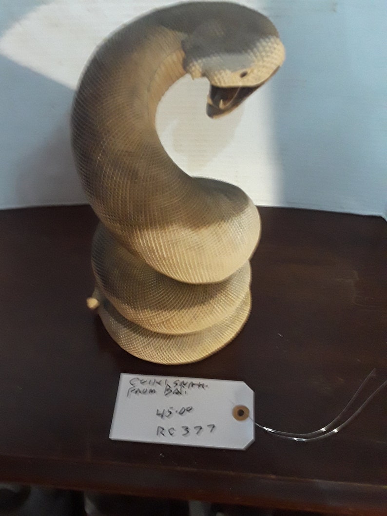 Snake coiled from Bali hard wood some teeth missing