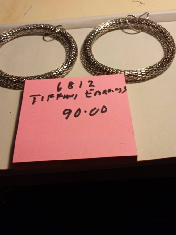 Tiffany i think hoop earrings i think.  Silver 925