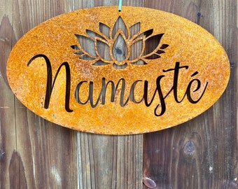 Rusty metal plaque with the inscription "Namaste"
