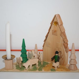 Erzgebirge candlestick with motif platform, vintage candle holder with Christmas figures, original GDR Ostalgie