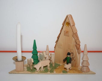 Erzgebirge candlestick with motif platform, vintage candle holder with Christmas figures, original GDR Ostalgie