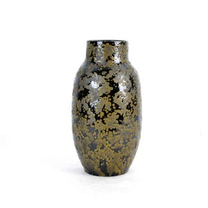 May include: A black and gold ceramic vase with a speckled pattern. The vase has a rounded body and a narrow opening.
