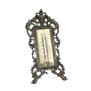 Historicism thermometer with bronze table stand around 1880 Table thermometer design putto grimaces antique Rocaille