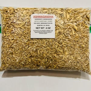 May include: A clear plastic bag filled with dried ashwagandha root pieces. A white label displays the text "ASHWAGANDHA" and "NET WT 4 OZ". The bag contains a light brown, natural product, suitable for dietary supplements.