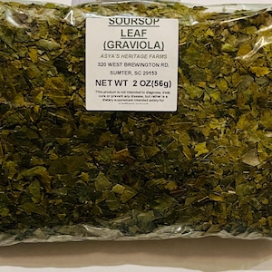 May include: A clear plastic bag filled with dried green soursop leaves. A white label displays the text "SOURSOP LEAF (GRAVIOLA)" and "NET WT 2 OZ (56g)". The product is from Asya's Heritage Farms, located in Sumter, SC.