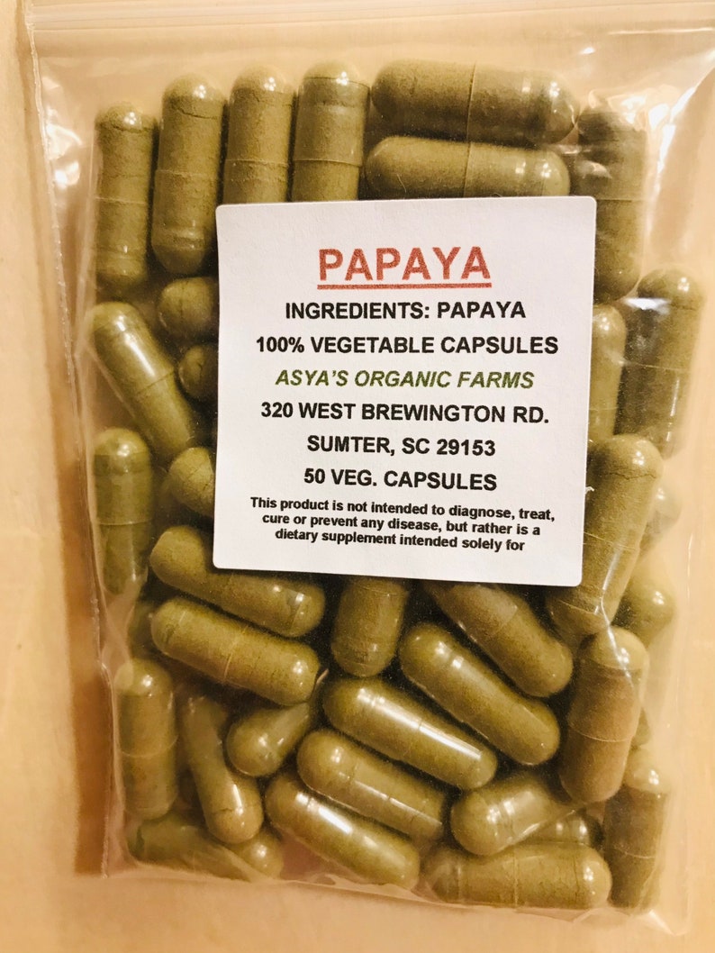 May include: A bag of 50 papaya vegetable capsules from Asya's Organic Farms. The bag is labeled with the ingredients, address, and contact information.  The capsules are a light green color.