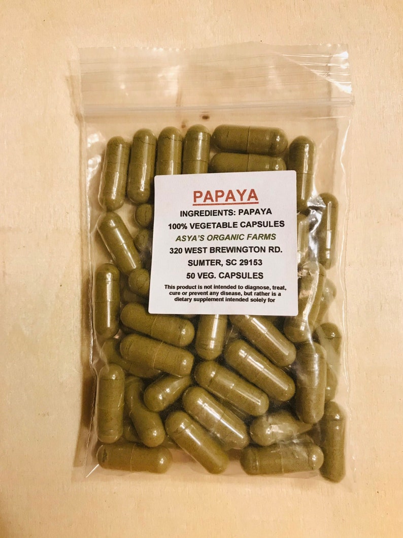 May include: A clear plastic bag filled with 50 green papaya capsules. The bag has a label that reads "PAPAYA INGREDIENTS: PAPAYA 100% VEGETABLE CAPSULES ASYA'S ORGANIC FARMS 320 WEST BREWINGTON RD. SUMTER, SC 29153 50 VEG. CAPSULES This product is not intended to diagnose, treat, cure or prevent any disease, but rather is a dietary supplement intended solely for"