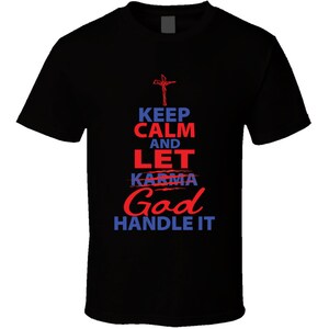 May include: Black t-shirt with a white cross and the text "Keep Calm and Let Karma God Handle It" in red and blue.