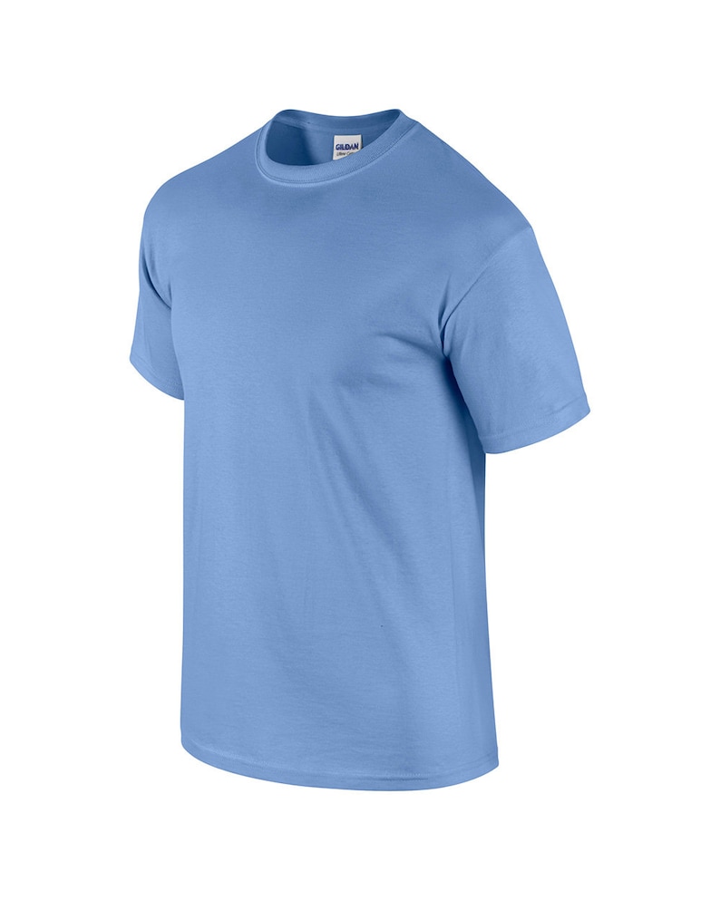 May include: A light blue short-sleeved t-shirt.