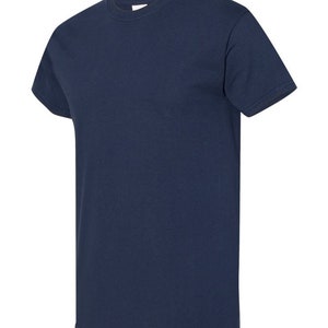 May include: A plain navy blue t-shirt with short sleeves.