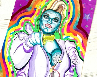 May include: A colorful illustration of a person with blue skin, blonde hair, and a purple and white jacket. The person is pointing at the viewer with a serious expression. The background is a rainbow of colors with stars.