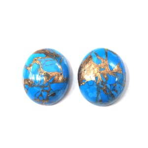 May include: Two round turquoise cabochons with gold flecks. The cabochons are smooth and polished.