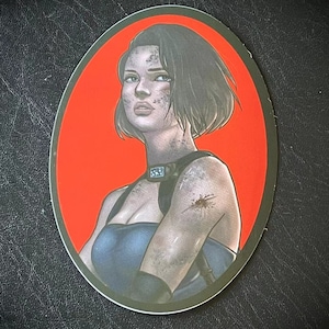 May include: A sticker featuring a digital illustration of a woman with short black hair, wearing a blue tank top and a black choker. The background is a solid red circle.