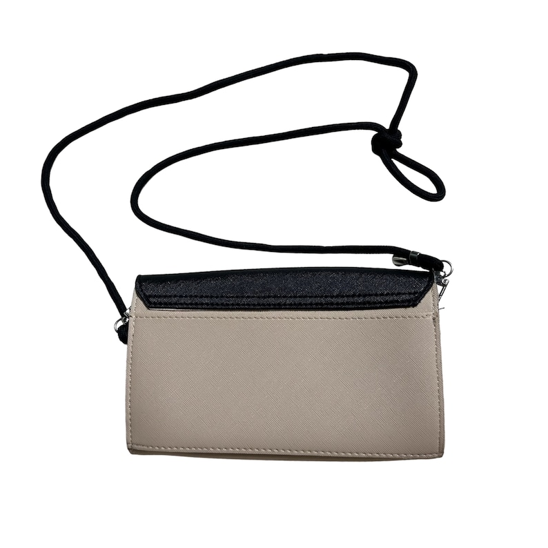 May include: A beige and black crossbody purse with a black adjustable strap. The purse has a flap closure and a silver accent.