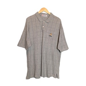May include: Gray and black plaid short-sleeved polo shirt with a small embroidered bear logo and the text "The Original" on the left chest.