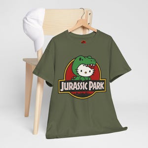 Hello Kitty Jurassic Park T-Shirt | Kawaii Dinosaur Mashup Tee | Cute Pink Graphic Shirt | Unisex Cotton Tee | Funny Movie Crossover Gift image 8