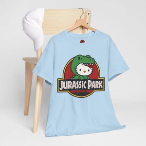 Hello Kitty Jurassic Park T-Shirt | Kawaii Dinosaur Mashup Tee | Cute Pink Graphic Shirt | Unisex Cotton Tee | Funny Movie Crossover Gift image 9